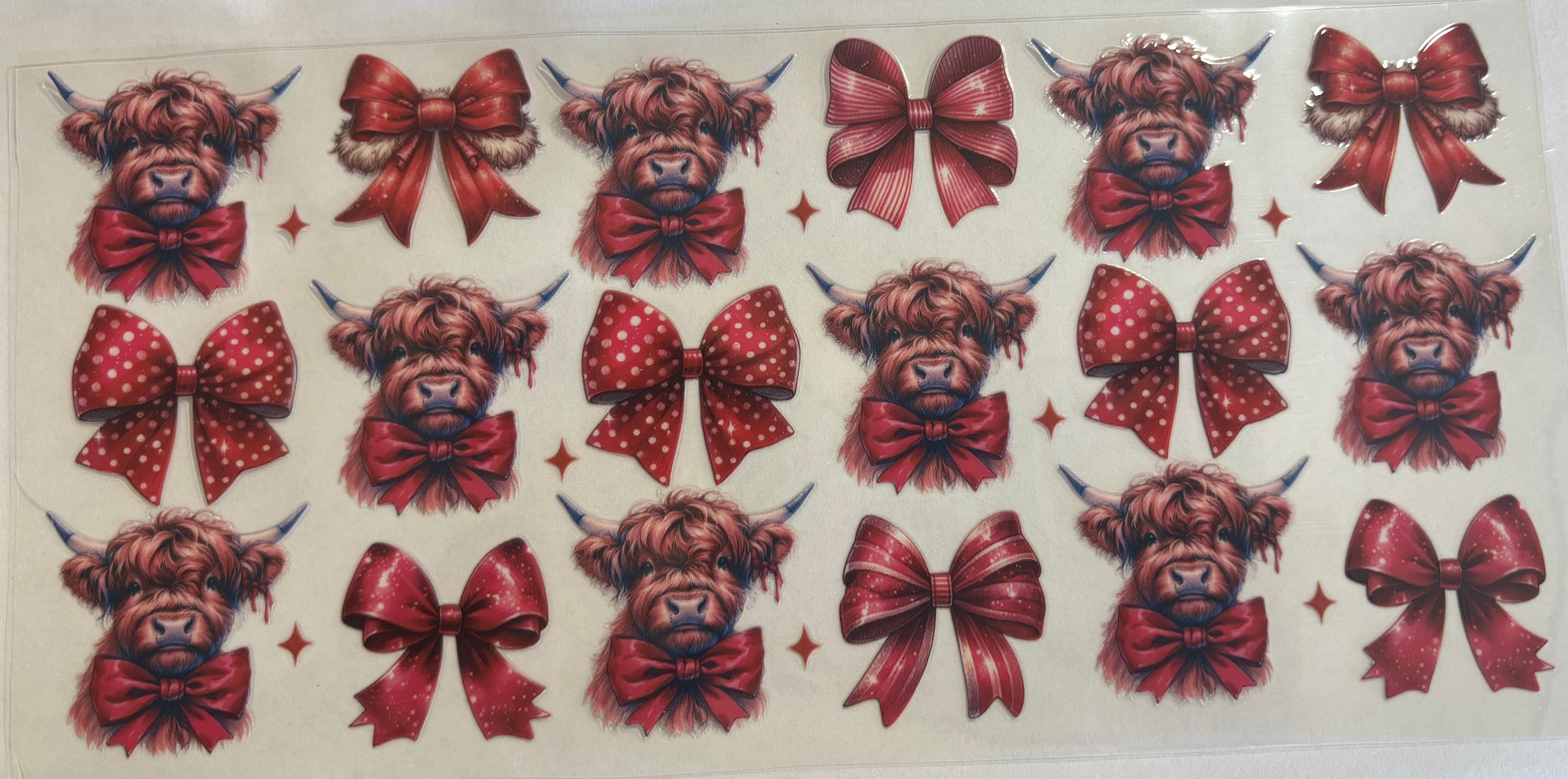 Highland cow with red bows
