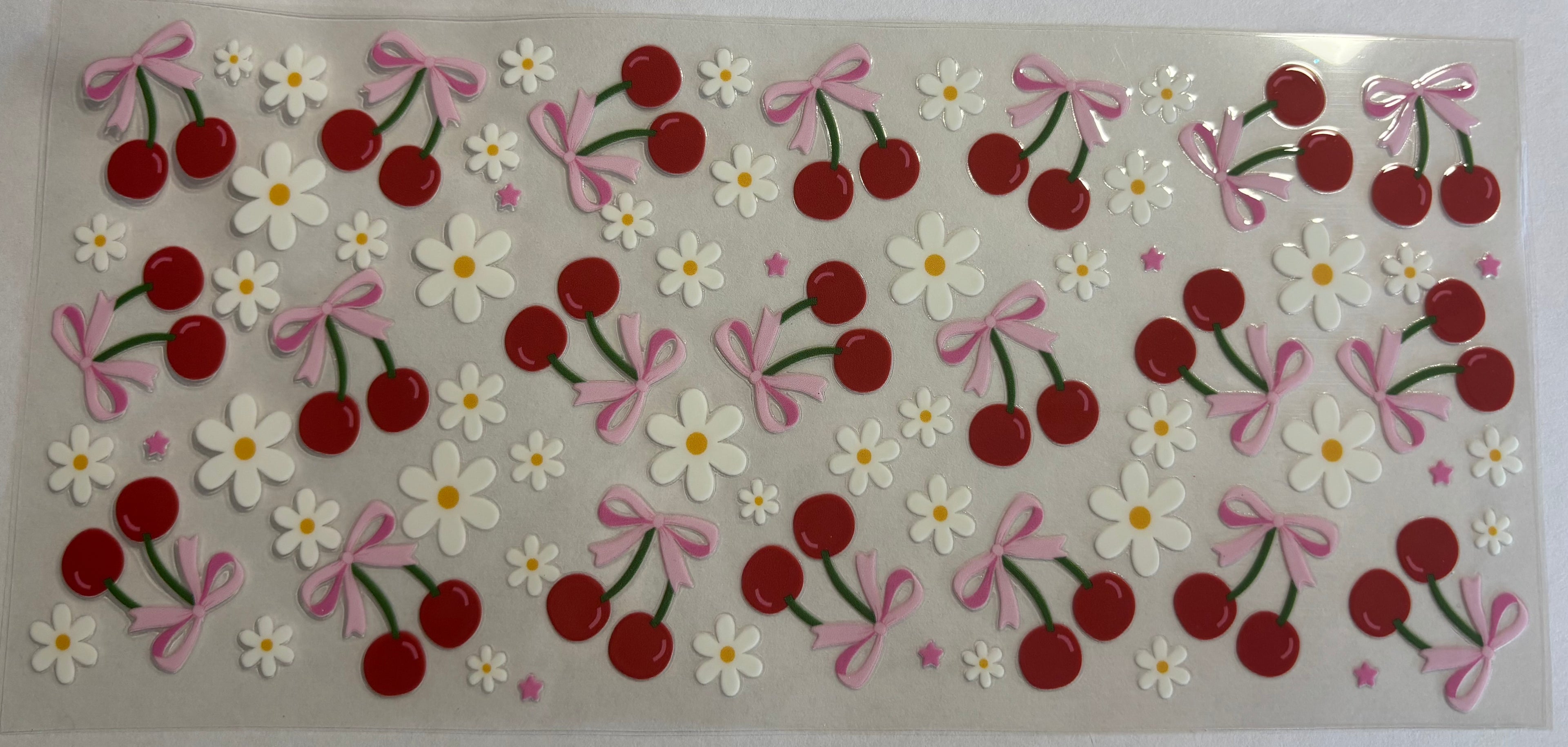 Cherries with white flowers and pink bows